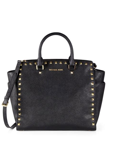 michael kors trunk bag black|Michael Kors black studded handbag.